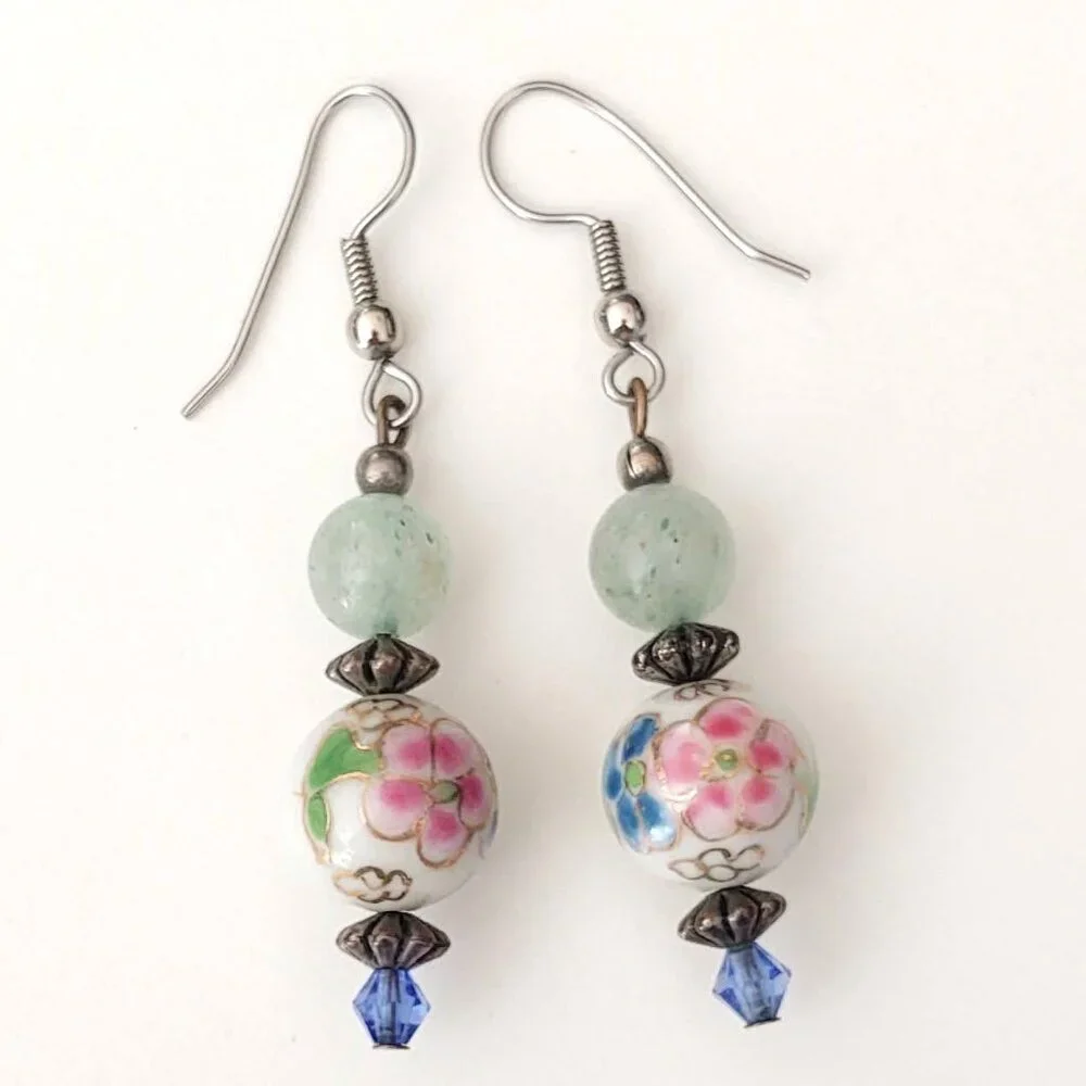 Floral painted ceramic beaded earrings with green and blue bead accents